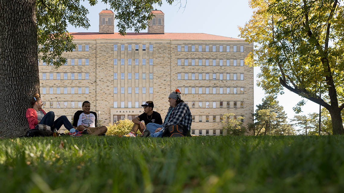 students on lawn in front of fraser hall